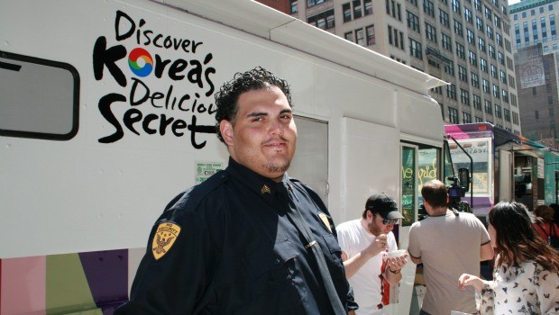 David Rodriguez is employed by a Taste of Korea food truck to mind the lines that are sometimes 50 people long.